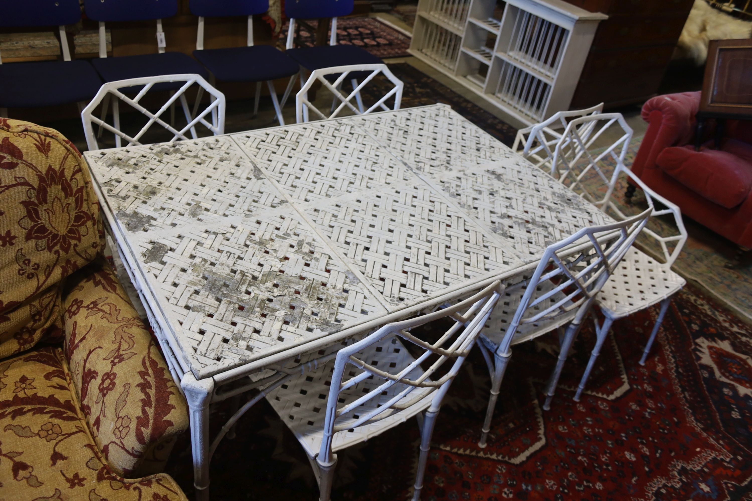A painted aluminium faux bamboo rectangular garden table, length 130cm, depth 88cm, height 71cm and six chairs